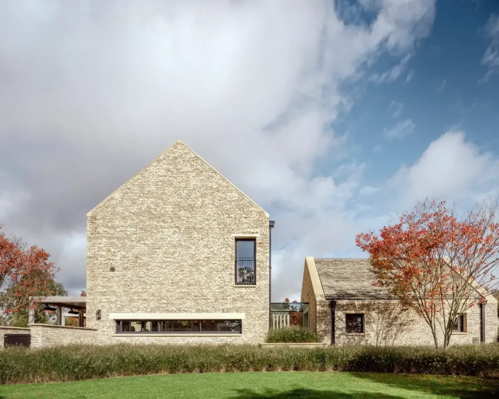 An outside view of a private residency in Cirencester built with Cotswold brick.